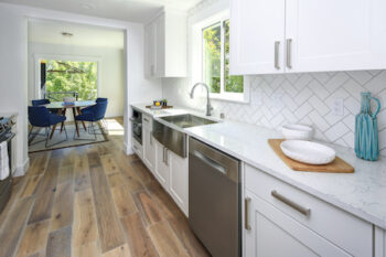 Remodeled Kitchen With Pure White Cabinets.